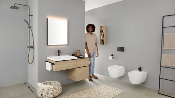 Man looking pleased in a bathroom