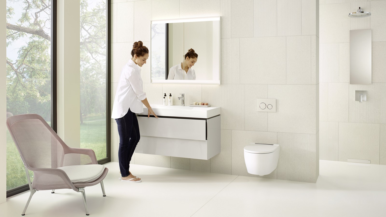 Woman in a white bathroom from the Geberit ONE series Woman in a white bathroom from the Geberit ONE series
