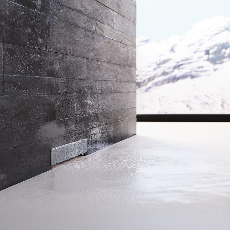 Geberit wall drain in black brick wall Geberit wall drain in black brick wall