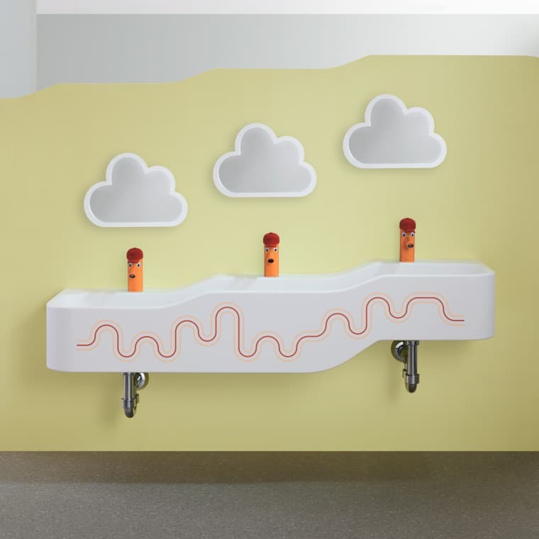 Geberit Bambini play and washspace in carmine red and orange Geberit Bambini play and washspace in carmine red and orange