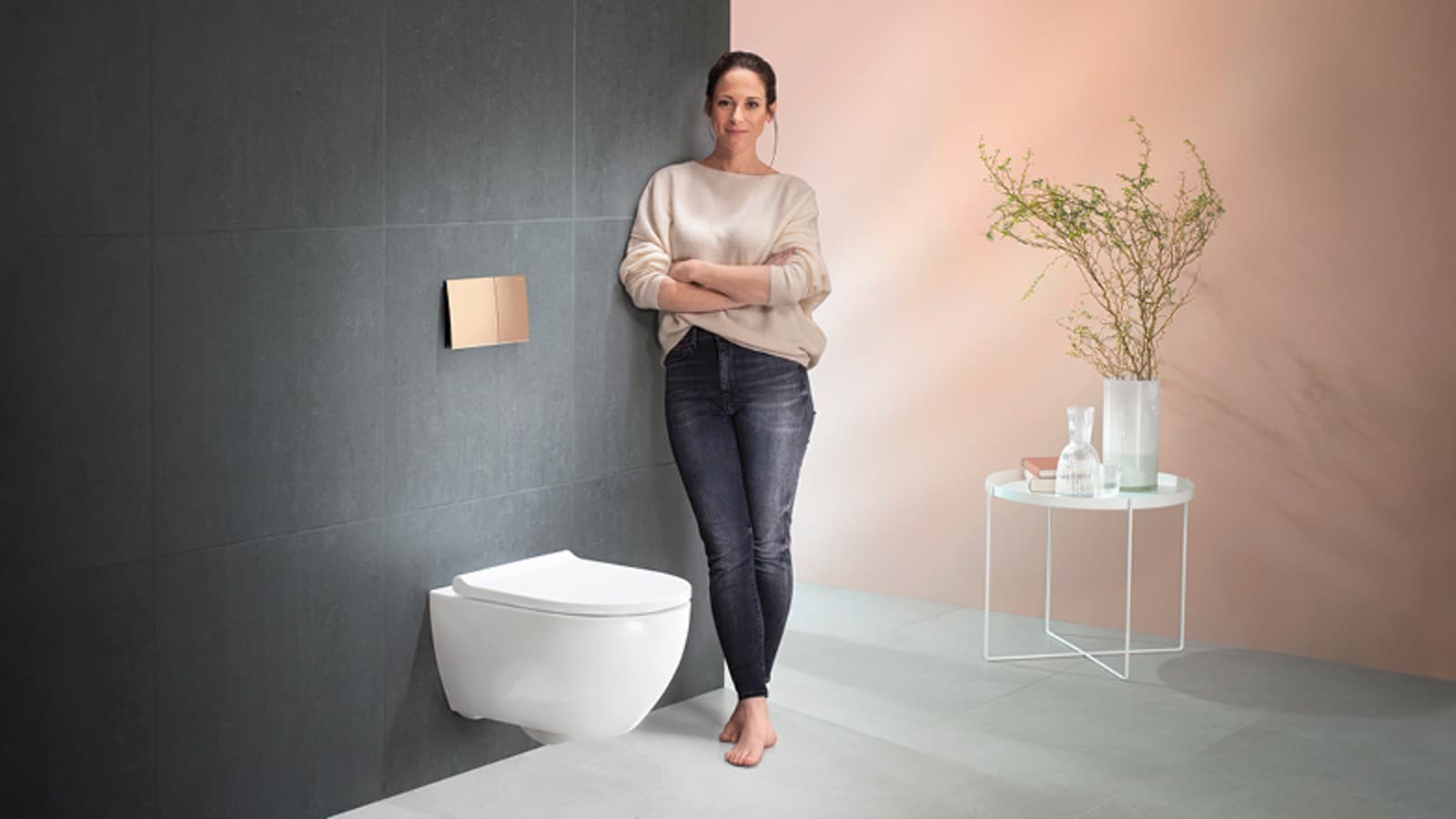 Satisfied woman next to her Geberit Acanto toilet Satisfied woman next to her Geberit Acanto toilet