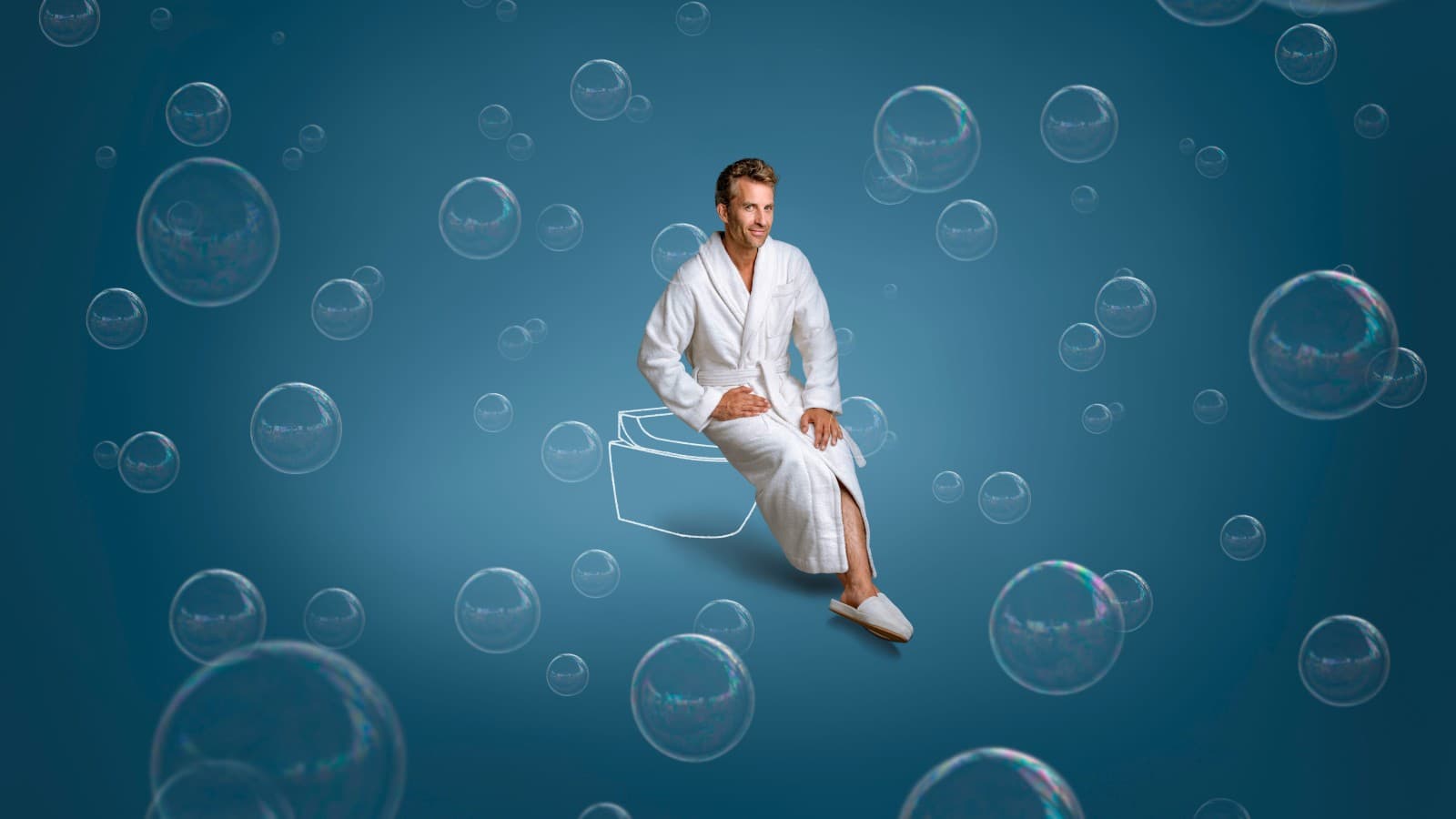 Tim sits on the Geberit AquaClean Tuma shower toilet. Tim sits on the Geberit AquaClean Tuma shower toilet.