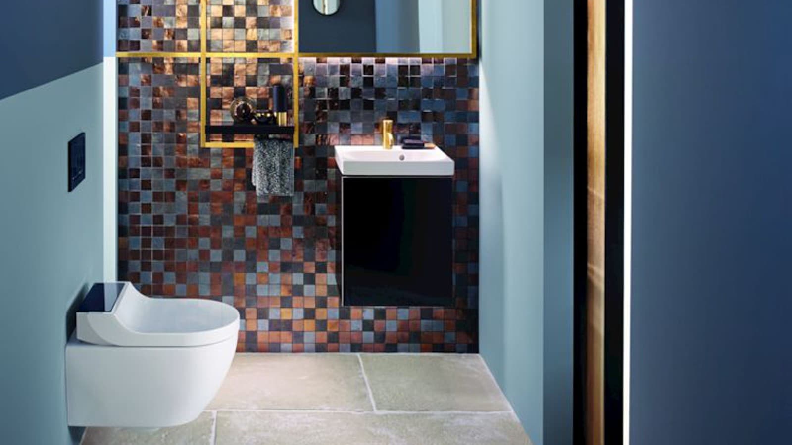 Gold and copper tones add warmth to this guest WC Gold and copper tones add warmth to this guest WC